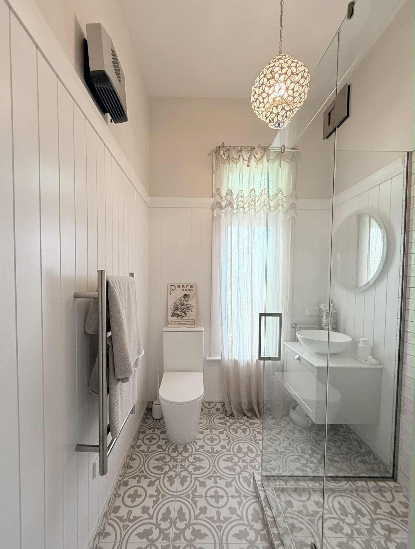 Powder room with patterned tile floor