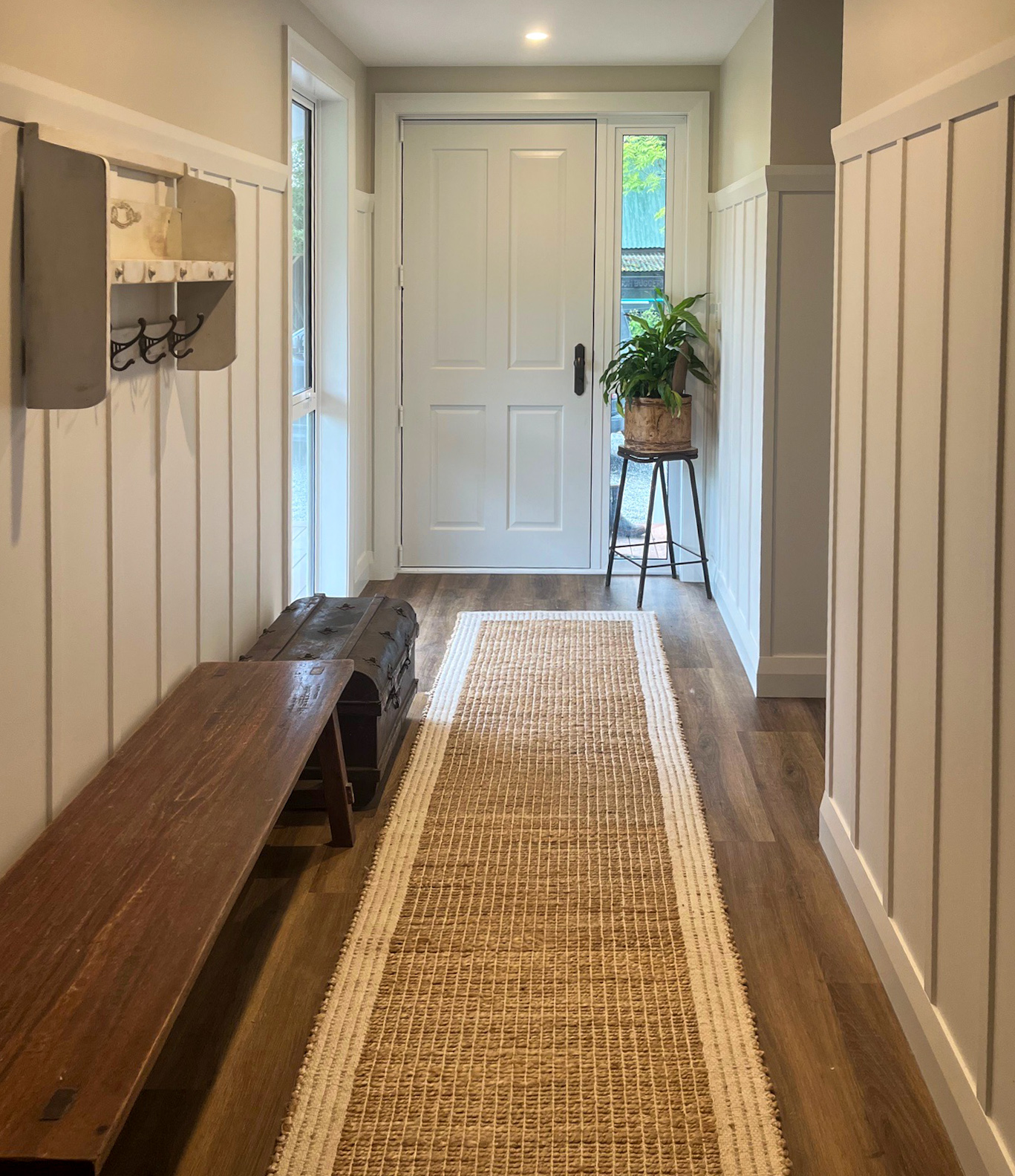 Entry hallway with timber bench and panelling
