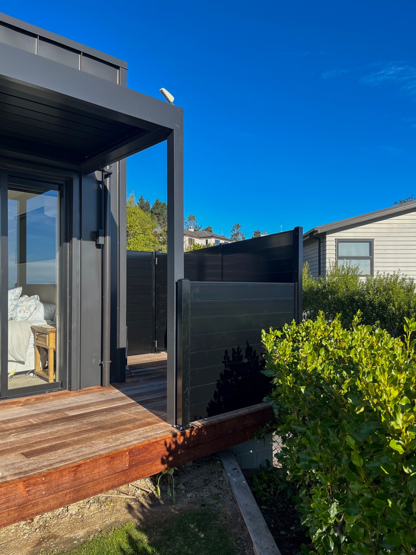 Pergola and aluminium screening beside bedroom